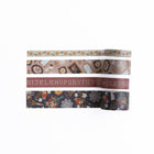 Fyra rullar dekorationstejp är utrullade. Motiv med blommor, fåglar, saxar, tavlor och alfabetet. Washi tape - Frame Wall - 4-pack - från Archer & Olive - Tidformera