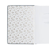 Insidan av pärmen på Forest Impressions dotted notebook från Archer & Olive. Tidformera
