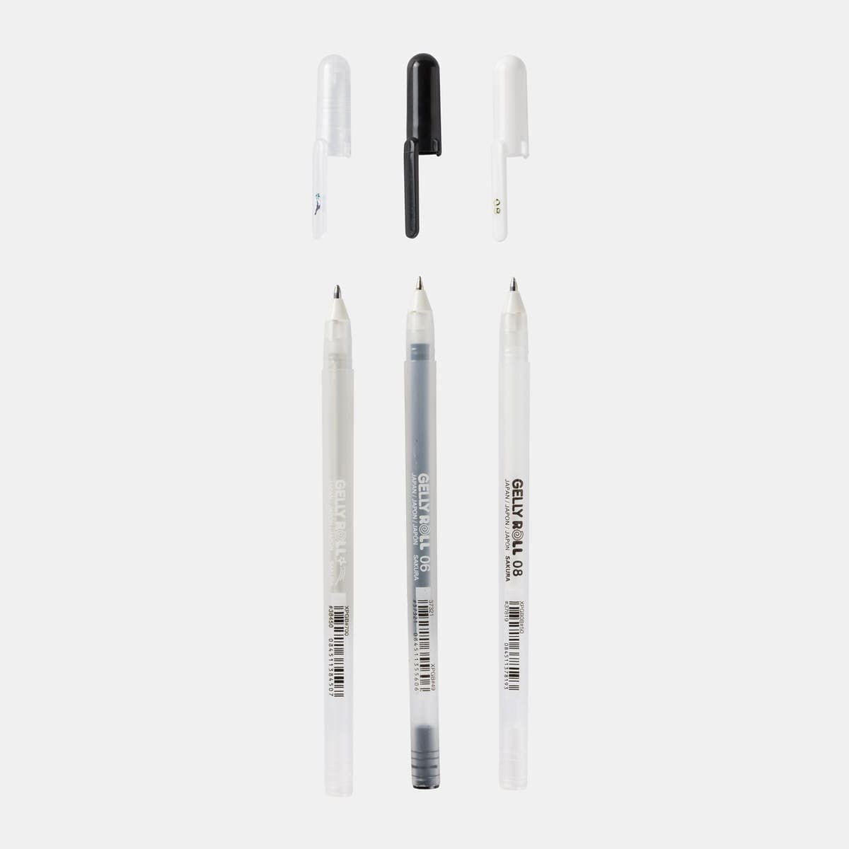 Gelly roll Gelpenna 3 - pack - Basic från  Sakura. Tre pennor med avtagna lock. Pennorna har färgerna silver, svart och vitt. - Tidformera