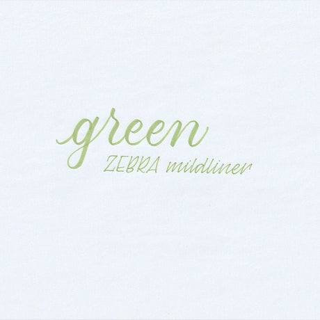 Handskriven text med orden "green" och "ZEBRA mildliner" i grön färg, skriven med Zebra Mildliner Brush Pen i färgen Green.