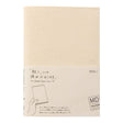 Creamfärgat bokomslag i sin förpackning. På förpackning står MD Notebook Paper cover A5.