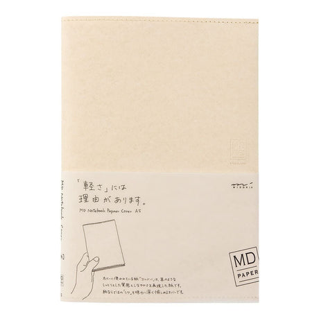 Creamfärgat bokomslag i sin förpackning. På förpackning står MD Notebook Paper cover A5.